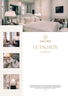 Sacher Gutschein mit luxuriösem, hellem Hotelzimmer in Creme- und Goldtönen, eleganter Einrichtung und feinen Textilien.
