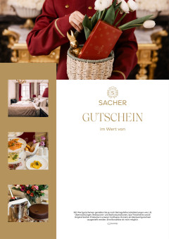 Osterkorb befüllt mit Original Sacher-Würfel und Blumen